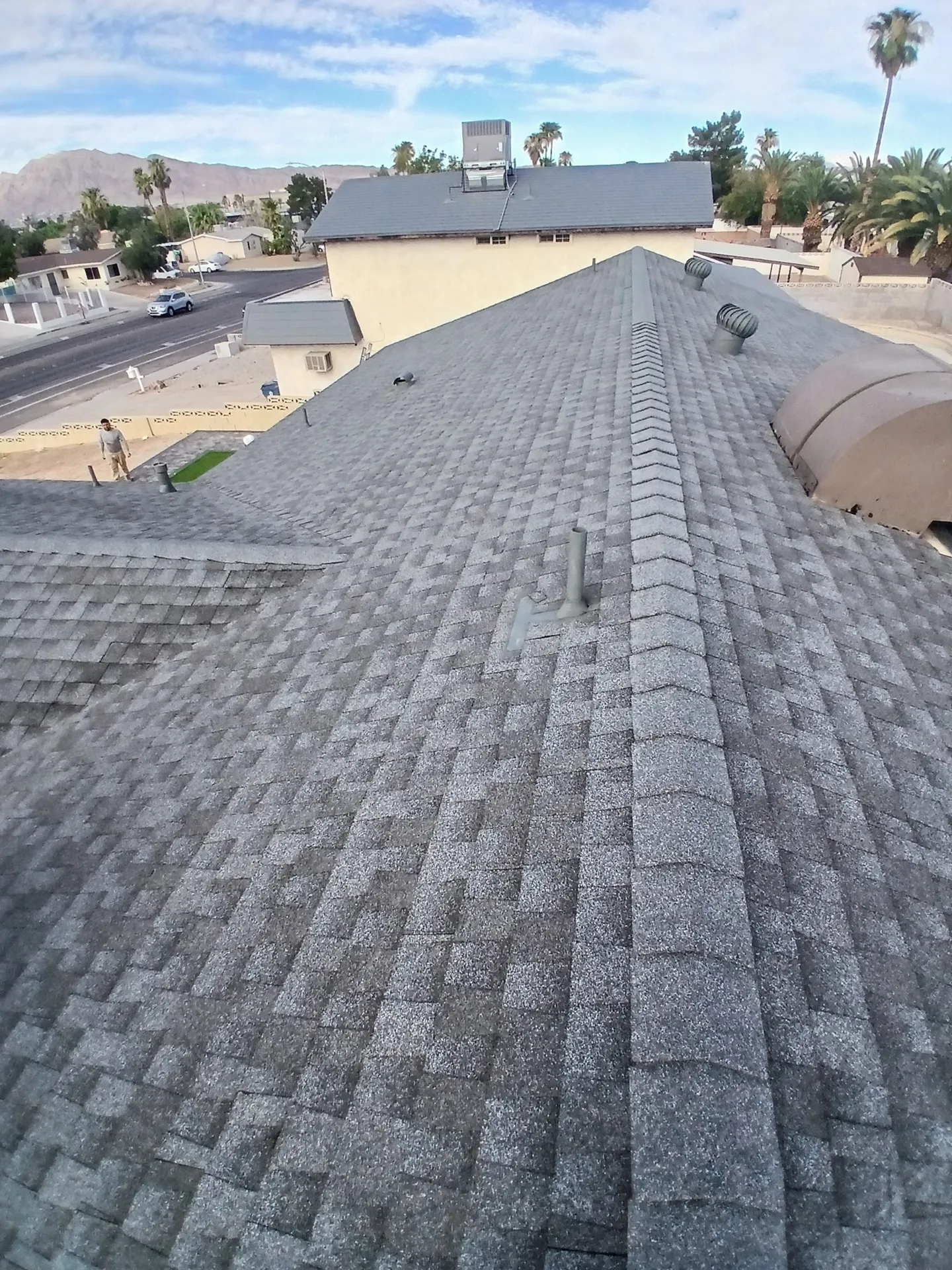 New gray shingle roof along the ridge