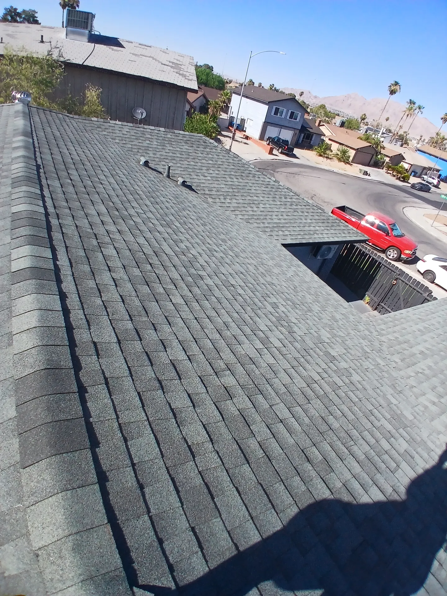 Completed residential gray shingle roof