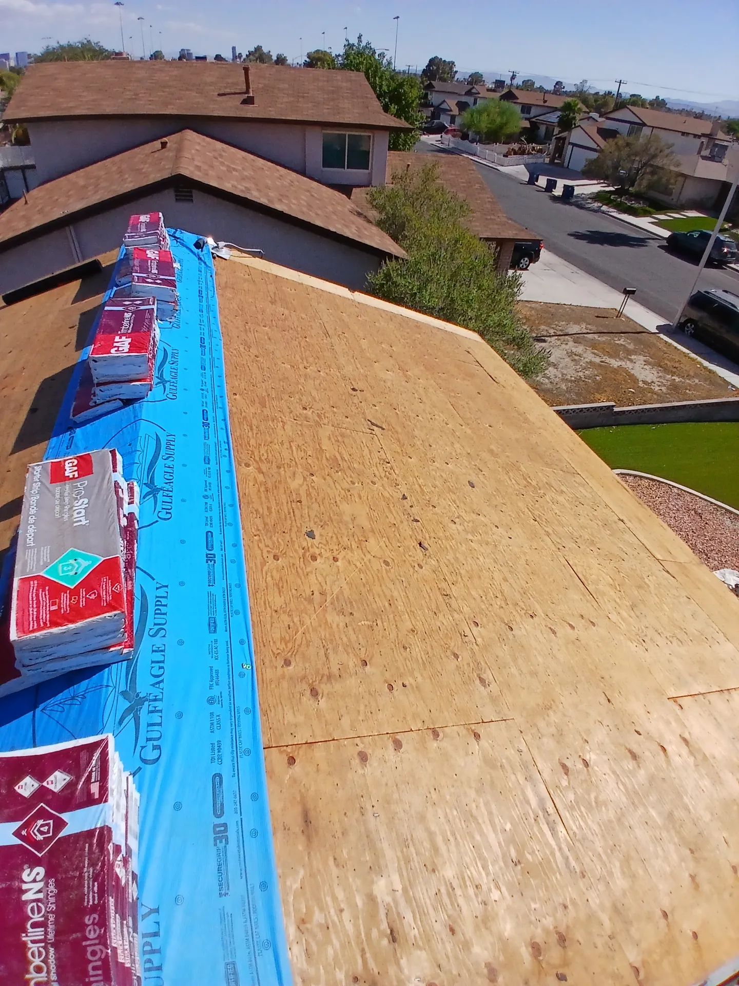 Roof replacement in progress with new decking