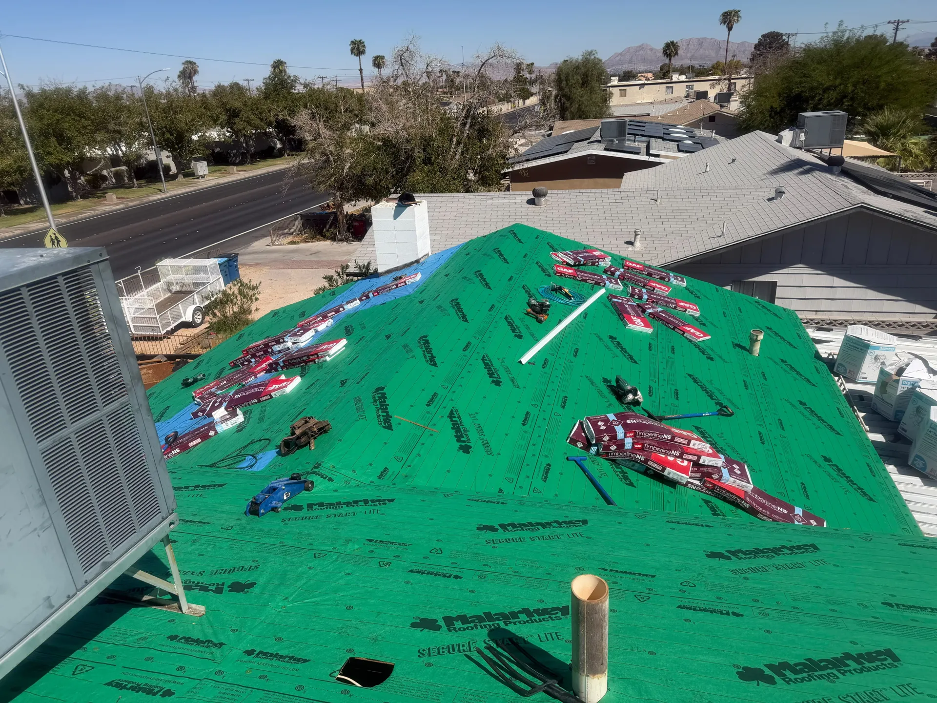 Lopez Roofing job site with underlayment and GAF shingles in Las Vegas